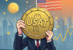 Man holding the USAT coin, covering his face